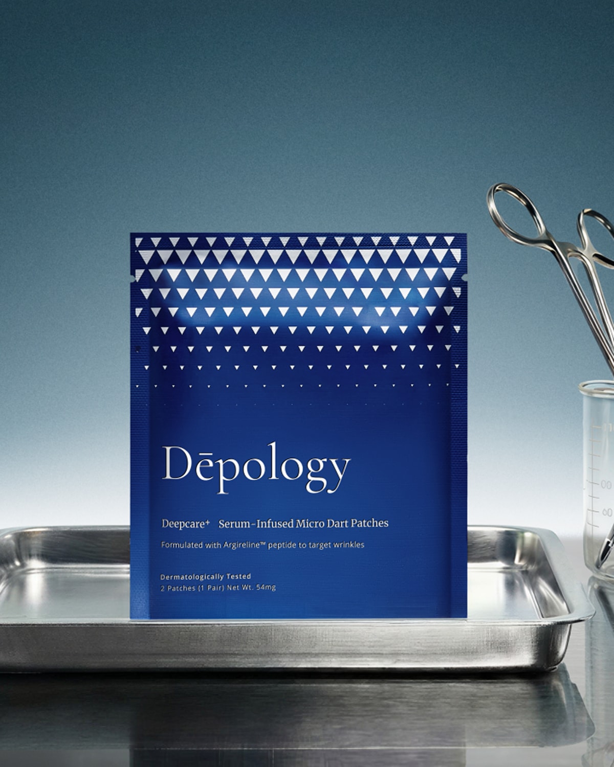 Blue packaging with white triangle pattern and 'Depology' branding on a metallic surface.