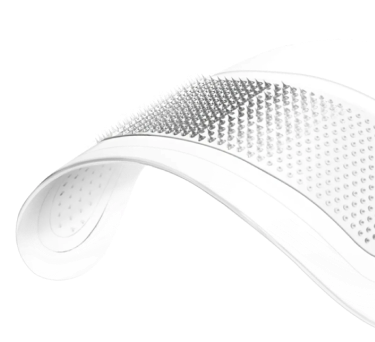 Close-up of a white shoe with textured sole on a white background